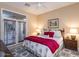 Comfortable bedroom with French doors and neutral decor at 8270 E Corrine Dr, Scottsdale, AZ 85260