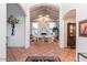 Spacious foyer with vaulted ceilings, tile flooring and views into the living room at 8270 E Corrine Dr, Scottsdale, AZ 85260