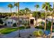 Single-story home showcasing the beautiful landscaping, and circular driveway at 8270 E Corrine Dr, Scottsdale, AZ 85260