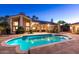 Sparkling pool perfect for relaxation and entertainment with covered bar area at 8270 E Corrine Dr, Scottsdale, AZ 85260