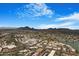 Aerial view of the cityscape with desert mountains in the background surrounding the community at 8653 E Royal Palm Rd # 1006, Scottsdale, AZ 85258