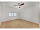 Neutral bedroom with window and ceiling fan at 8653 E Royal Palm Rd # 1006, Scottsdale, AZ 85258