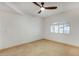 Bright bedroom featuring a ceiling fan, window with shutter and neutral decor at 8653 E Royal Palm Rd # 1006, Scottsdale, AZ 85258