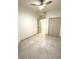 Bright bedroom features a closet, ceiling fan, and neutral tile at 8653 E Royal Palm Rd # 1006, Scottsdale, AZ 85258