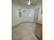 A breakfast nook features tile floors, three arched windows with shutters, and neutral color palette at 8653 E Royal Palm Rd # 1006, Scottsdale, AZ 85258