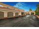 Exterior view of the complex showing garages, and a private entry gate to the community at 8653 E Royal Palm Rd # 1006, Scottsdale, AZ 85258