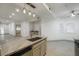 Contemporary kitchen island with granite countertops, pendant lighting, and an open layout perfect for entertaining at 8653 E Royal Palm Rd # 1006, Scottsdale, AZ 85258