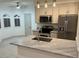 Bright kitchen featuring granite countertops, stainless steel appliances and pendant lighting at 8653 E Royal Palm Rd # 1006, Scottsdale, AZ 85258