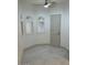 Corner living space with windows, tile floor and ceiling fan at 8653 E Royal Palm Rd # 1006, Scottsdale, AZ 85258