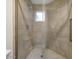 New shower featuring neutral tile and rainfall shower head at 8653 E Royal Palm Rd # 1006, Scottsdale, AZ 85258