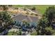 Stunning aerial view of a tile roof home adjacent to lush green golf course with mature trees at 9440 N 57Th St, Paradise Valley, AZ 85253