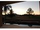 Picturesque backyard vista showcasing palm trees, a swimming pool, and stunning views of the distant mountains at 9440 N 57Th St, Paradise Valley, AZ 85253