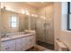 Modern bathroom featuring double sinks, glass shower, and updated fixtures at 9440 N 57Th St, Paradise Valley, AZ 85253