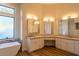 Bright bathroom with double sinks, quartz countertops and modern fixtures at 9440 N 57Th St, Paradise Valley, AZ 85253