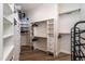 Well-organized walk-in closet with custom shelving, drawers, and hanging rods for ample storage at 9440 N 57Th St, Paradise Valley, AZ 85253