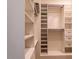 Bright walk-in closet with built-in shelving and drawers, providing functional and stylish storage solutions at 9440 N 57Th St, Paradise Valley, AZ 85253