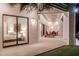 Outdoor patio area featuring lounge seating, with a view of a bedroom through sliding glass doors at 9440 N 57Th St, Paradise Valley, AZ 85253