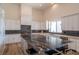 Spacious kitchen featuring an island with a marble countertop, sleek white cabinets, and modern appliances at 9440 N 57Th St, Paradise Valley, AZ 85253