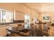 Gourmet kitchen featuring stone island with sink, white cabinetry, and open layout with bright, natural light at 9440 N 57Th St, Paradise Valley, AZ 85253