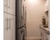 Laundry room featuring stacked washer and dryer with white cabinets and countertops at 9440 N 57Th St, Paradise Valley, AZ 85253