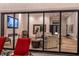 Open concept living room visible from covered patio with wood floors and neutral furniture at 9440 N 57Th St, Paradise Valley, AZ 85253