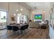 Spacious living room featuring high ceilings, elegant lighting, and a seamless transition to outdoor living at 9440 N 57Th St, Paradise Valley, AZ 85253