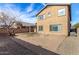 Backyard view of the two-story home featuring a covered patio and desert landscaping at 9545 W Williams St, Tolleson, AZ 85353