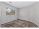 Neutral bedroom featuring soft carpet and a large window at 9545 W Williams St, Tolleson, AZ 85353