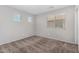 Bright bedroom featuring soft carpet and a large window at 9545 W Williams St, Tolleson, AZ 85353