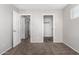 Neutral bedroom with carpet, closet, and adjacent room at 9545 W Williams St, Tolleson, AZ 85353