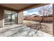 Covered patio area with concrete flooring and view of the spacious backyard and mature tree at 9545 W Williams St, Tolleson, AZ 85353