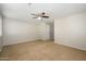 Large carpeted bedroom with neutral walls and ceiling fan perfect for new homeowners at 10219 E Isleta Ave, Mesa, AZ 85209