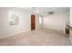 Spacious living room featuring neutral walls, carpet flooring, ceiling fan, and a view into other living spaces at 10219 E Isleta Ave, Mesa, AZ 85209