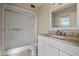 Beautiful bathroom featuring a shower and a white vanity with marble counters at 10509 W Oak Ridge Dr, Sun City, AZ 85351