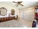 Bedroom featuring traditional furniture, carpeted floors, and ample closet space at 10611 W Camelot Cir, Sun City, AZ 85351