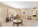 Bright and airy living room showcasing classic furniture, large windows, and elegant decor at 10611 W Camelot Cir, Sun City, AZ 85351