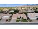 Aerial view of a beautiful single-Gathering home with a well-manicured lawn and three-car garage at 11256 E Palomino Rd, Scottsdale, AZ 85259