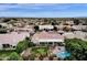 Aerial shot of home featuring a backyard with a pool, spa, and landscaped patio at 11256 E Palomino Rd, Scottsdale, AZ 85259