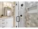 Modern bathroom featuring a glass-enclosed shower with designer tile and sleek fixtures at 11256 E Palomino Rd, Scottsdale, AZ 85259