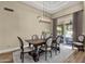 Well-lit dining room with a view of the outdoor pool area at 11256 E Palomino Rd, Scottsdale, AZ 85259