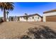 Spacious backyard featuring a detached garage and a well-maintained gravel landscape at 113 W Rawhide Ave, Gilbert, AZ 85233