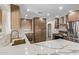 Spacious kitchen featuring modern cabinets, stainless steel appliances, an island with a marble countertop, and recessed lighting at 113 W Rawhide Ave, Gilbert, AZ 85233