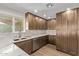 Modern kitchen with shaker cabinets, stainless steel appliances, marble countertops, and recessed lighting at 113 W Rawhide Ave, Gilbert, AZ 85233