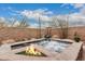 Relaxing outdoor water feature and fire feature surrounded by lush landscaping at 12129 W Desert Mirage Dr, Peoria, AZ 85383