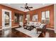 Inviting living room with stylish furniture, plantation shutters, and warm color palette at 12129 W Desert Mirage Dr, Peoria, AZ 85383