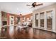 Expansive living room offers natural light, fireplace, and seamless indoor-outdoor living at 12129 W Desert Mirage Dr, Peoria, AZ 85383