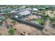 Aerial view showcasing the property's expansive backyard with landscaping, putting green, and outdoor living spaces at 13729 E Rancho Laredo Dr, Scottsdale, AZ 85262