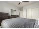 Modern bedroom featuring neutral walls, wood-look floors, and contemporary furniture at 13729 E Rancho Laredo Dr, Scottsdale, AZ 85262