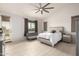 Tranquil main bedroom with neutral tones, vaulted ceiling, and outdoor access at 13729 E Rancho Laredo Dr, Scottsdale, AZ 85262