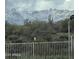 Breathtaking mountain view with snow-capped peaks, offering a picturesque backdrop to this desert home at 13729 E Rancho Laredo Dr, Scottsdale, AZ 85262